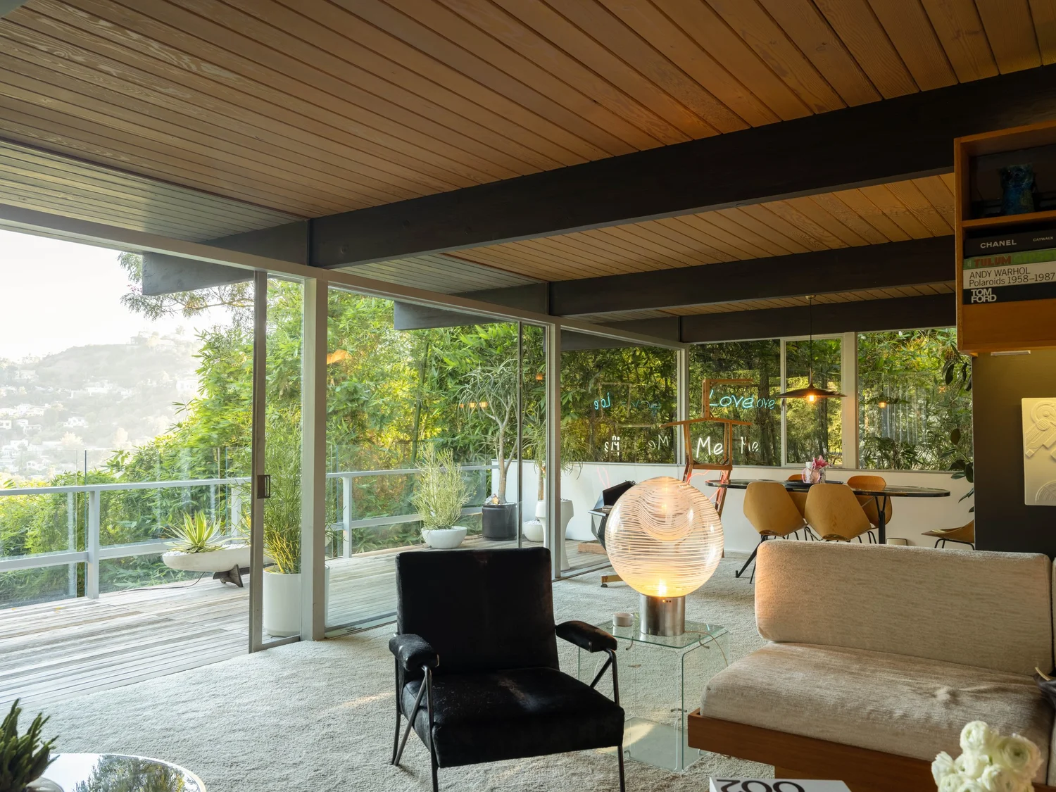 Dining area lined with floor-to-ceiling glass
