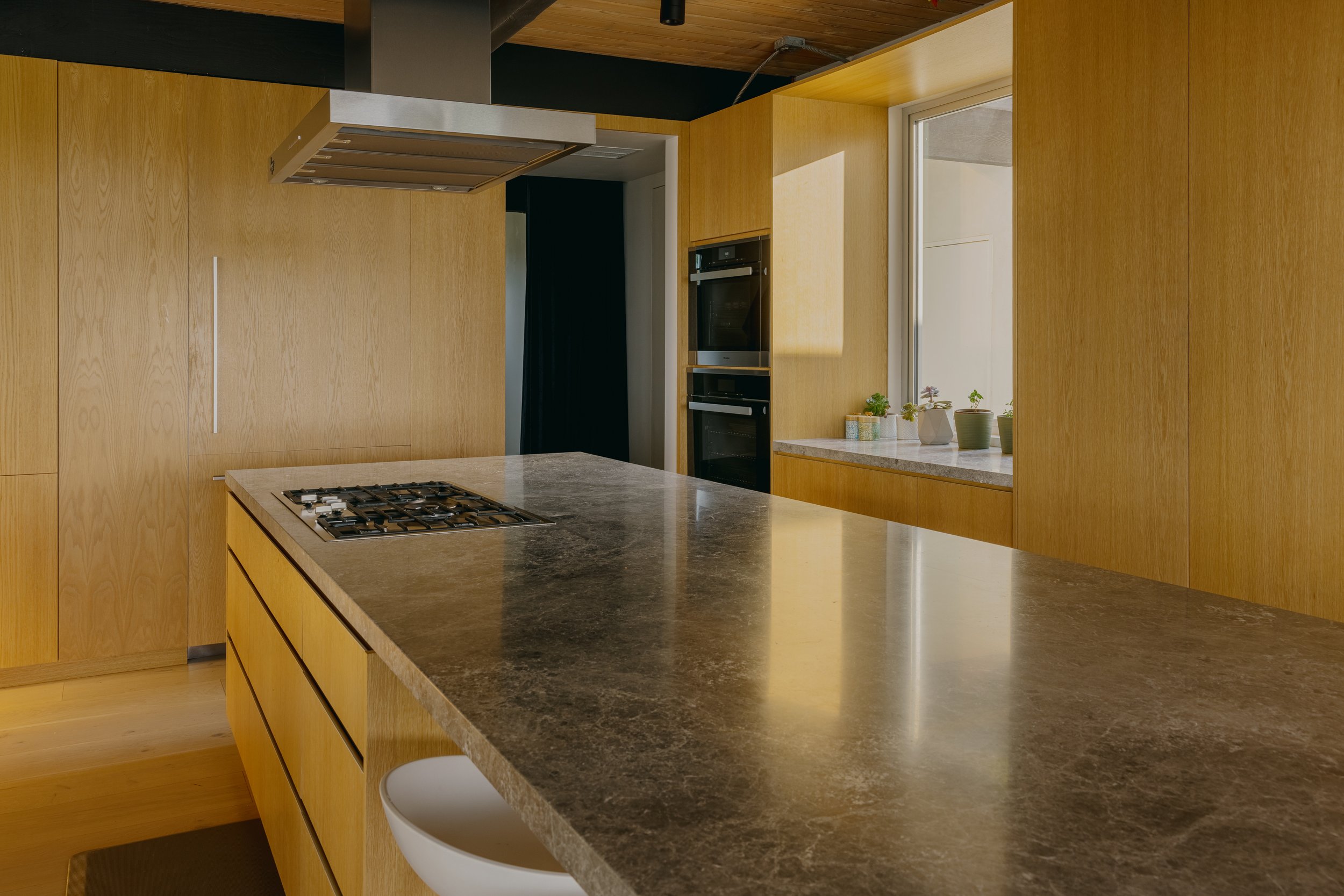 Restored kitchen island and timber cabinetry