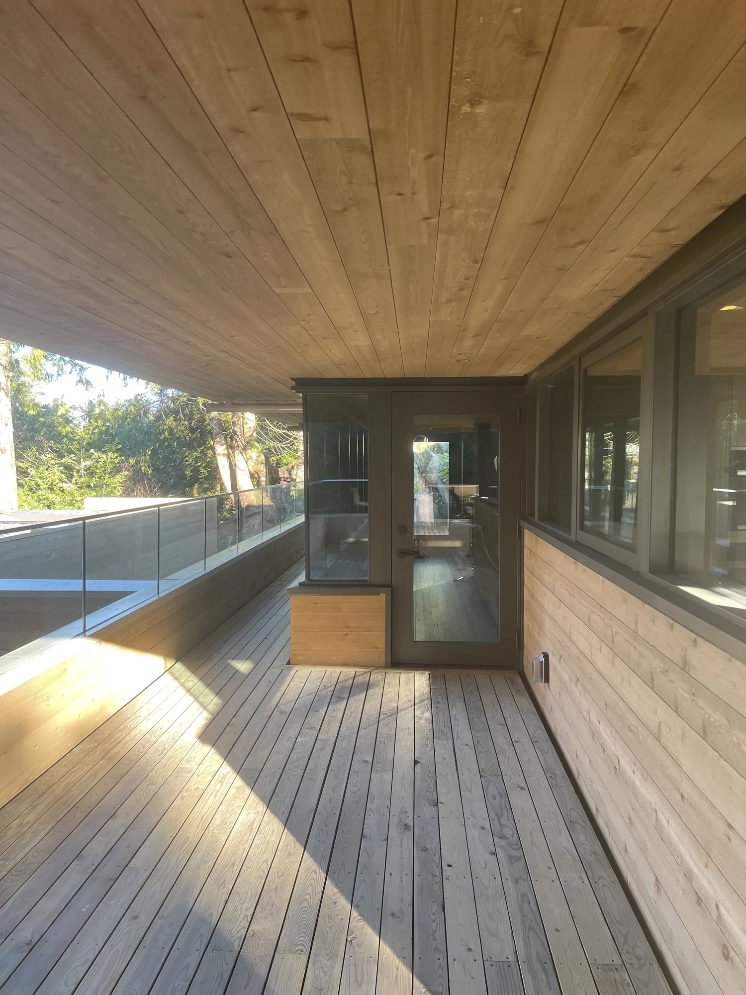 Cedar deck and soffit above the entry