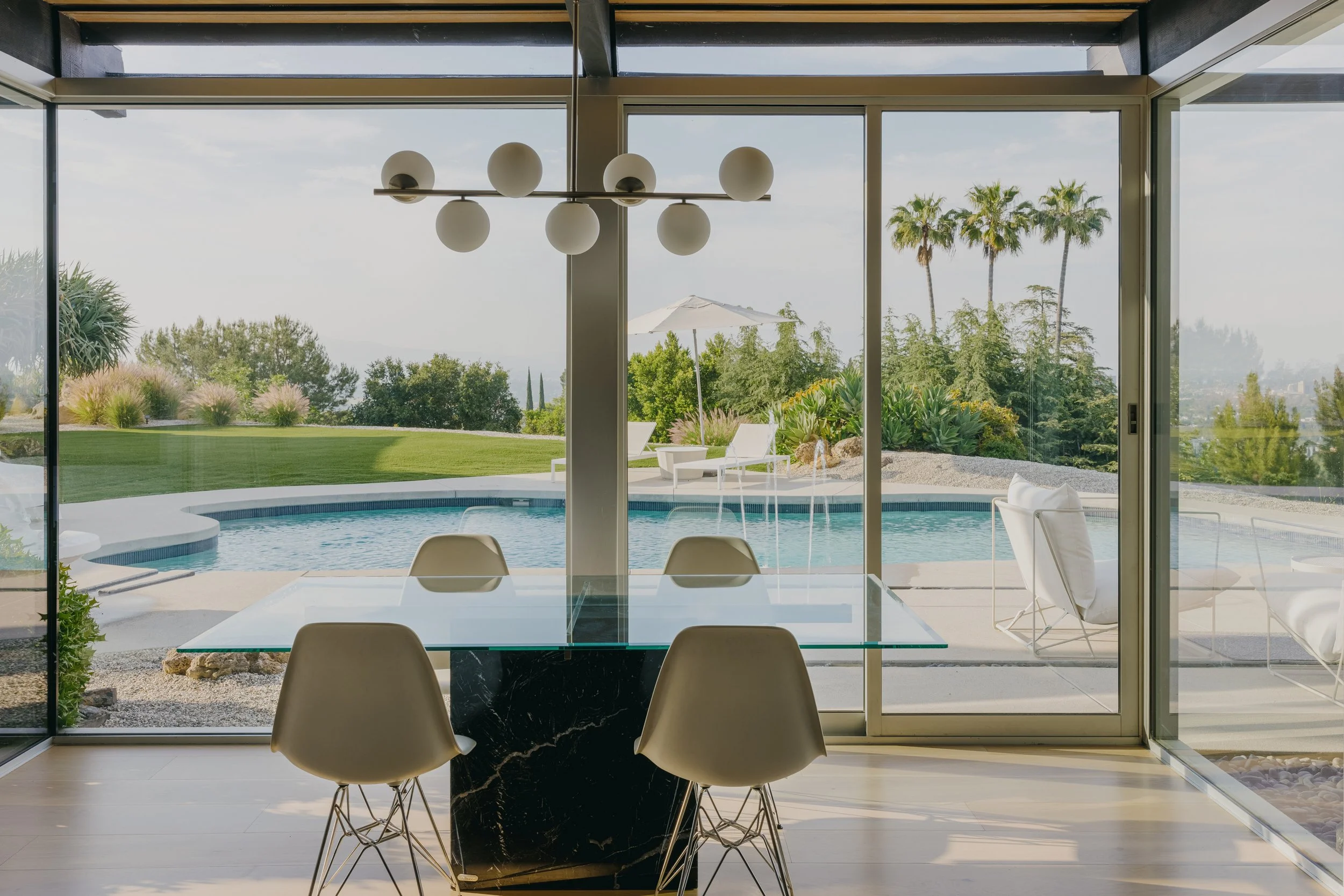Dining room opening to the pool and valley