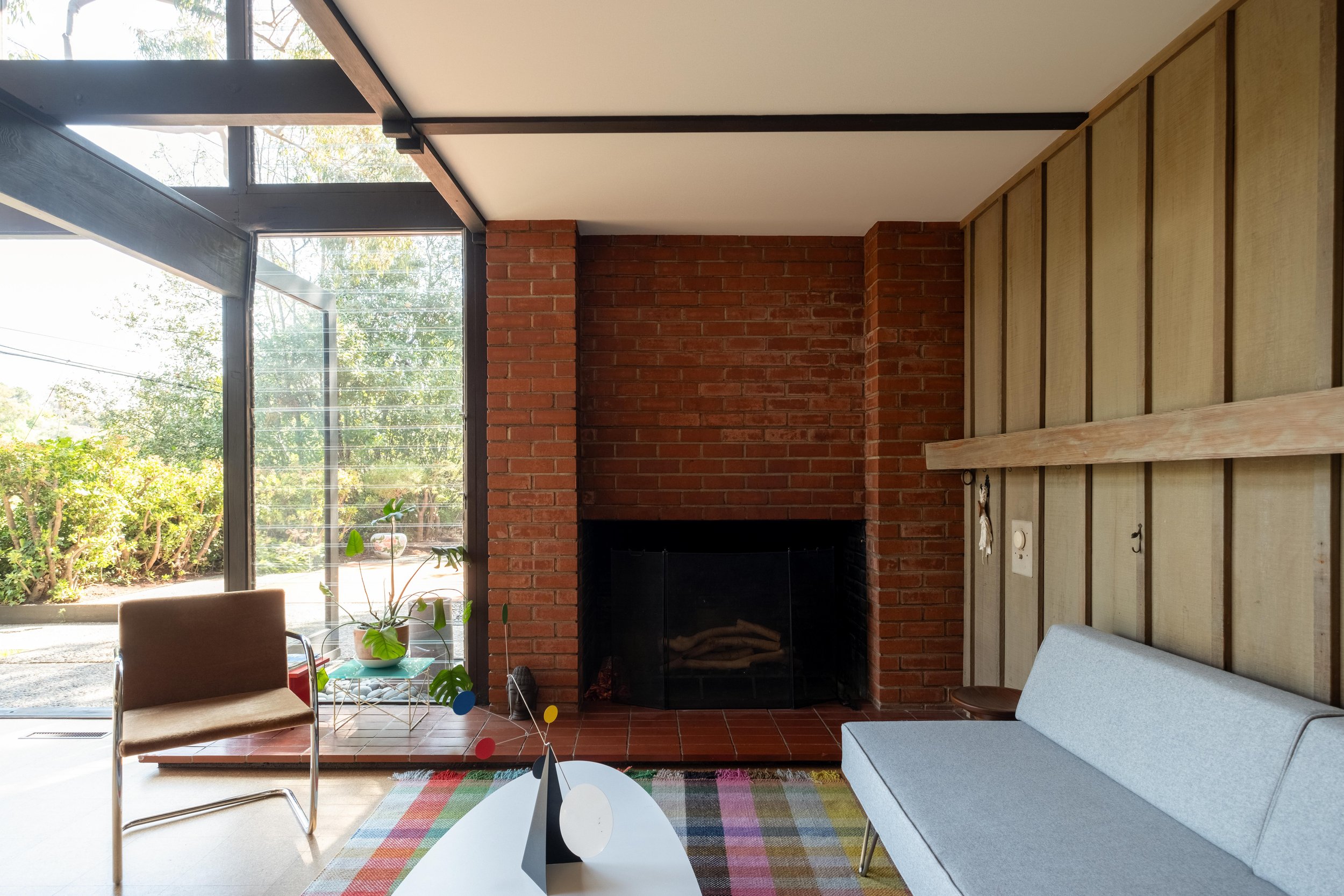 Double-height living room with brick hearth