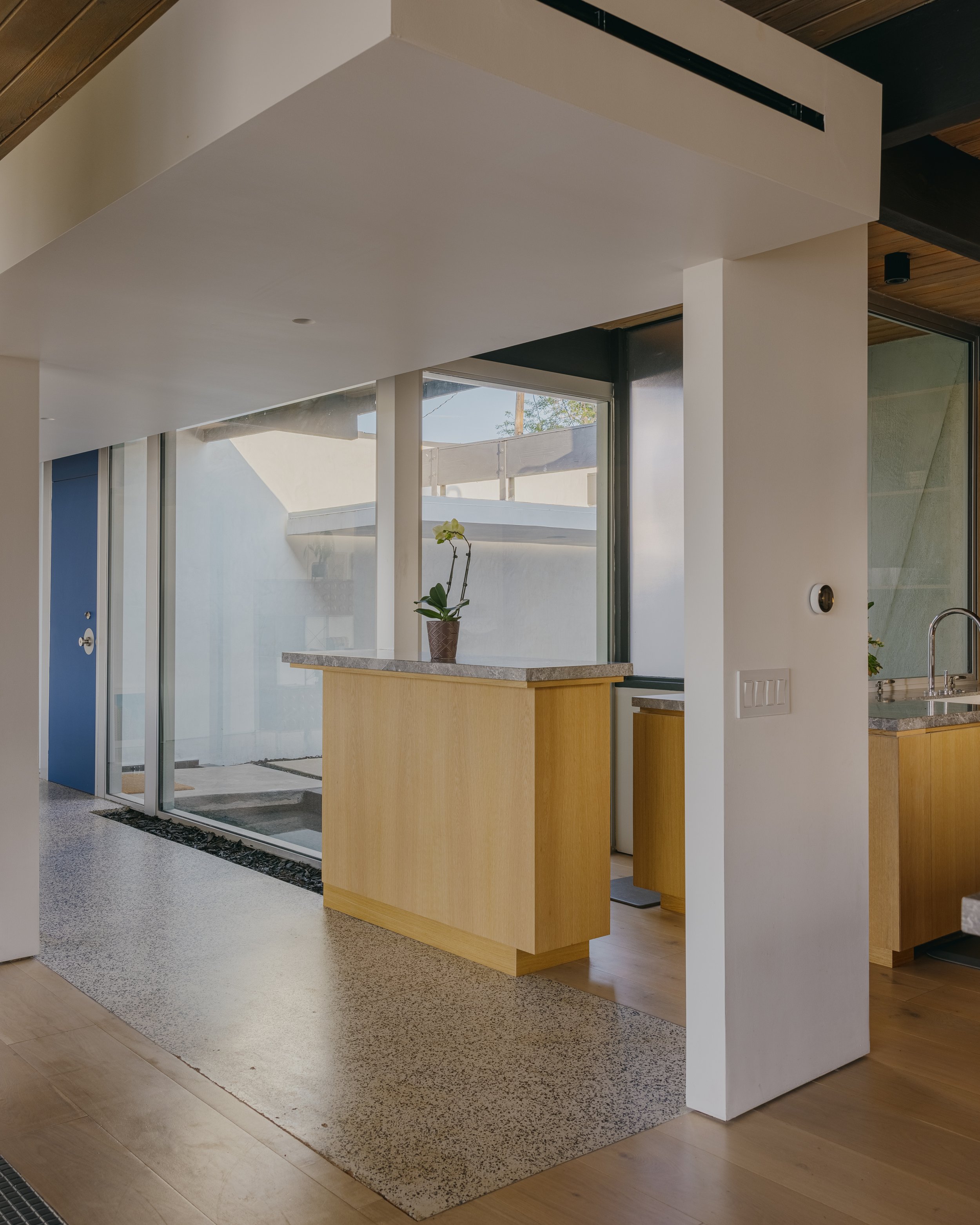Open-plan kitchen with concrete floors