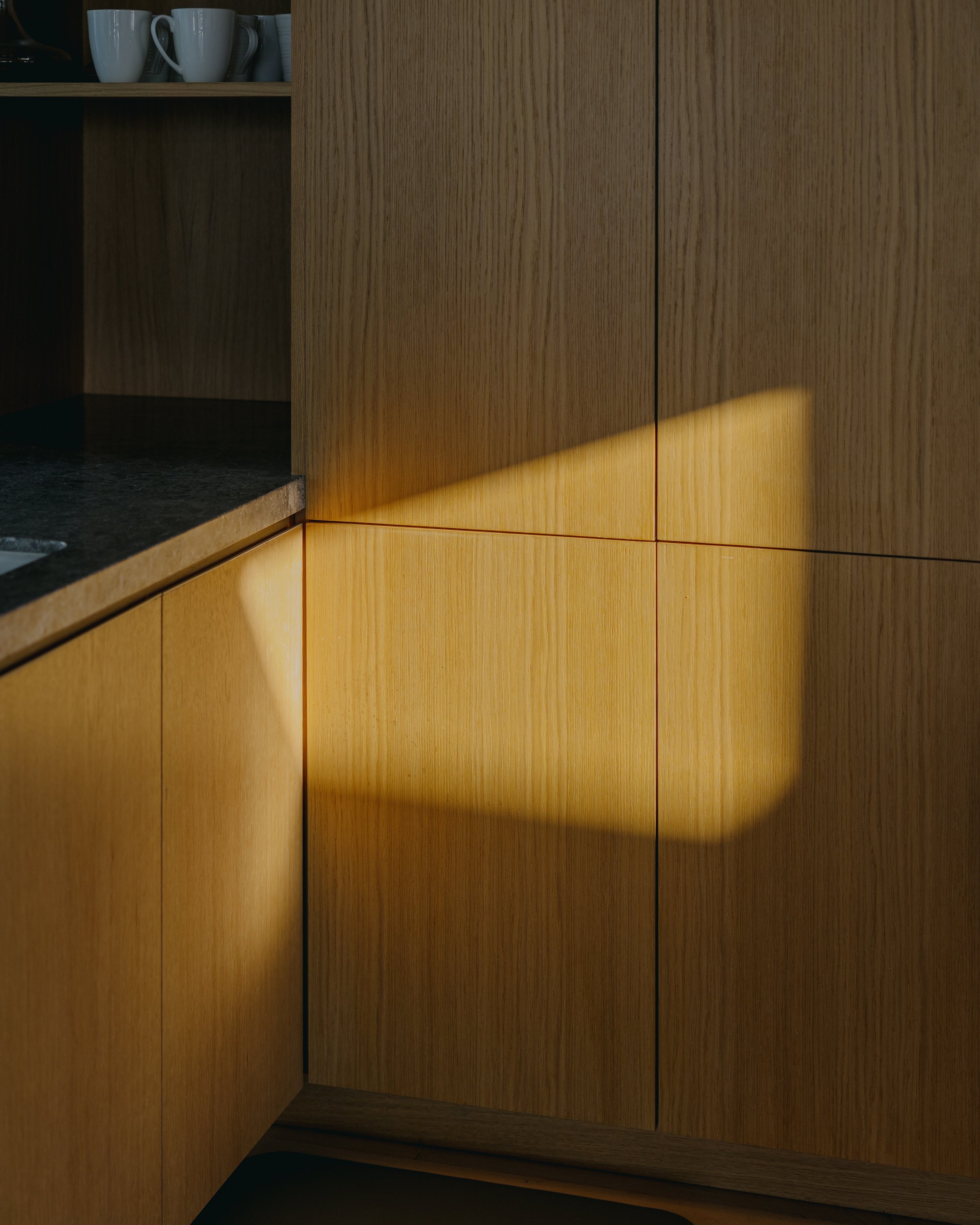 Sunlight across the timber joinery