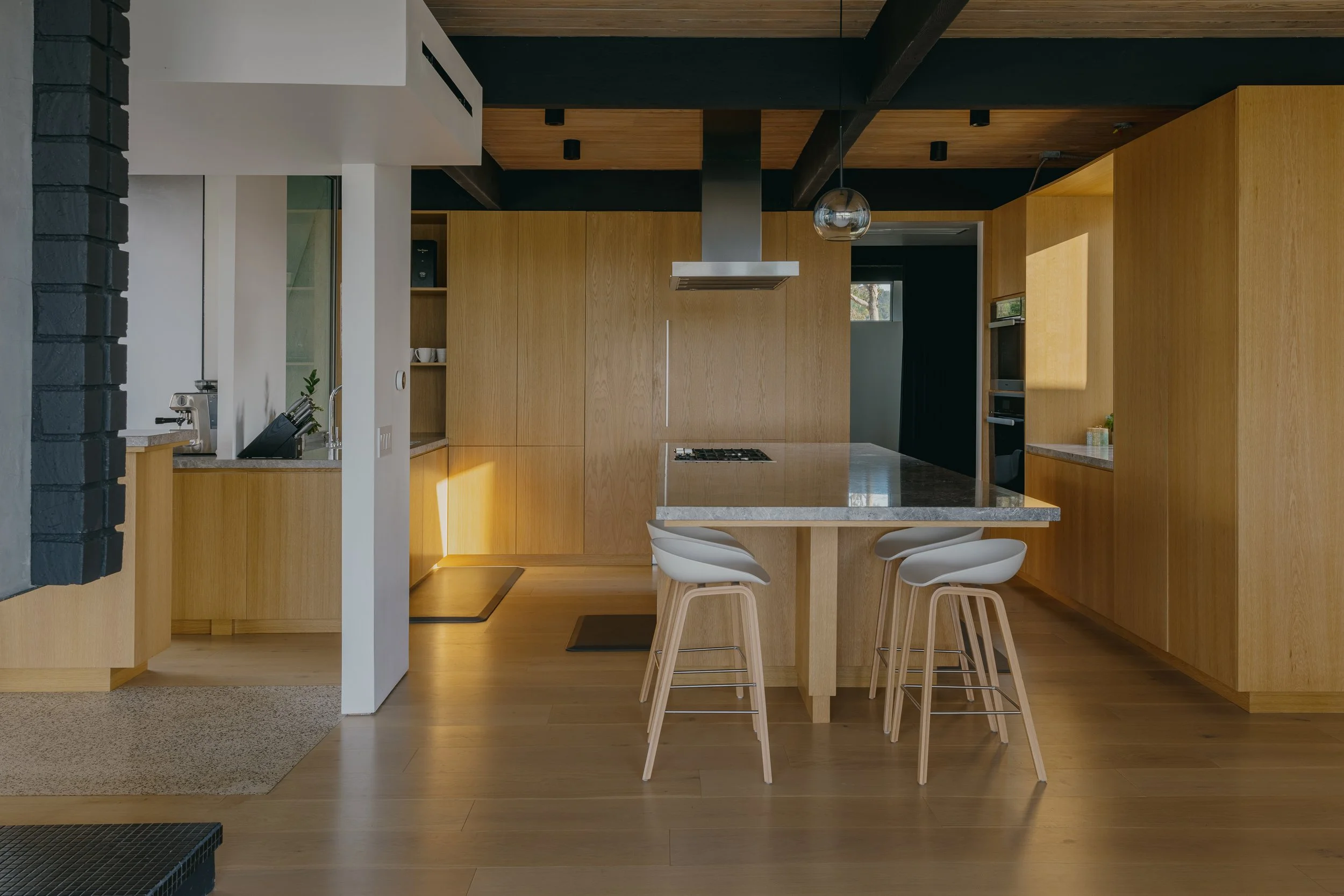 Warm timber kitchen beneath dark beams
