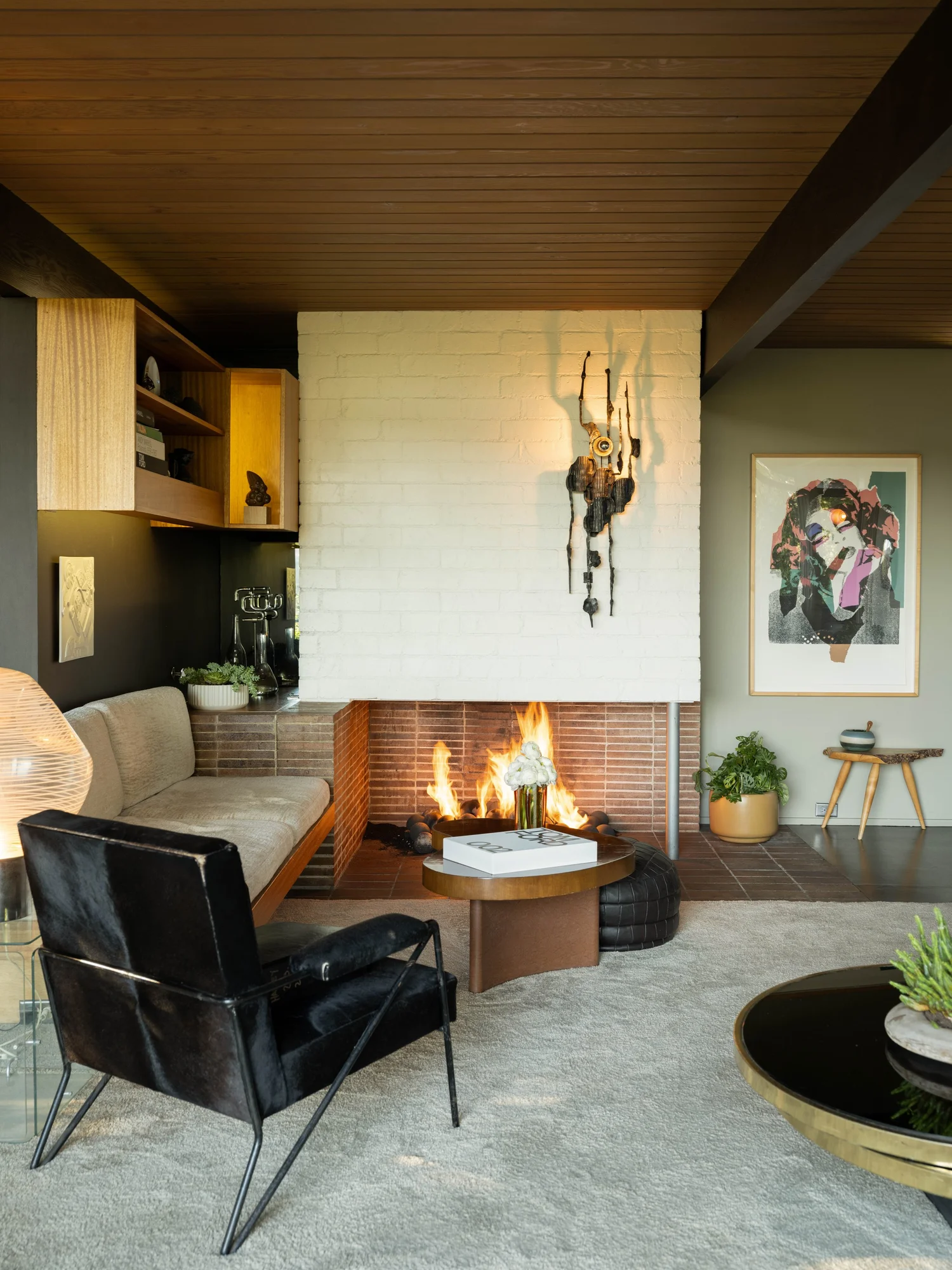 Living room opening through a mitered glass corner