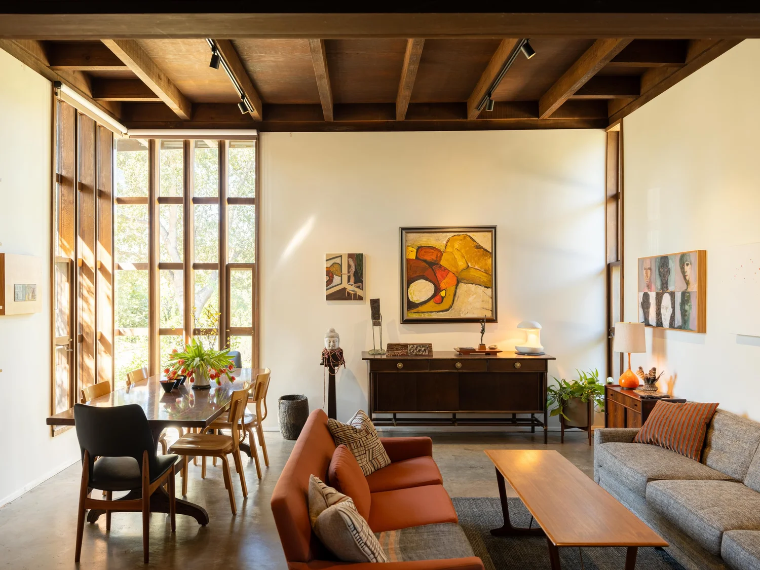 Living room with exposed beams and art