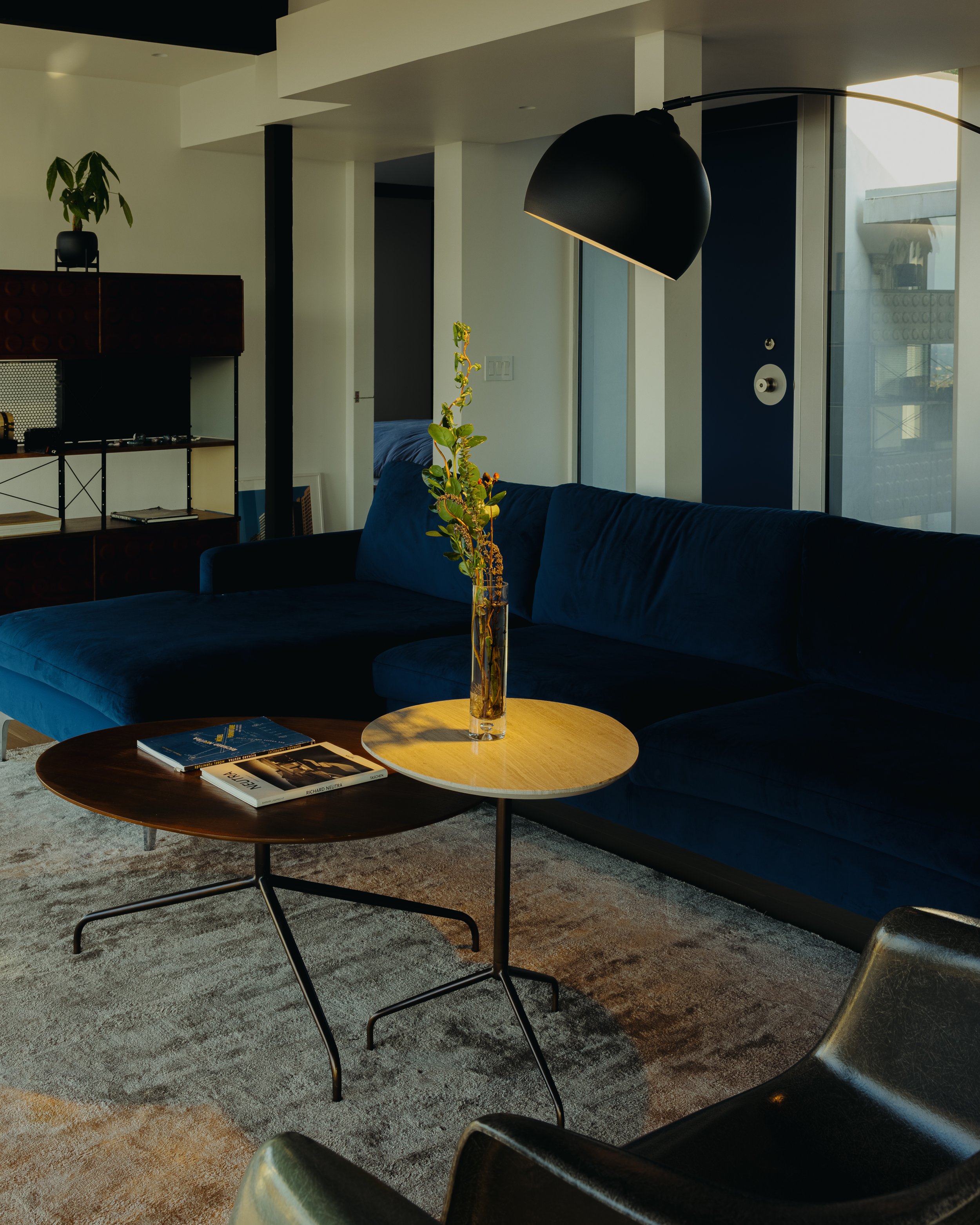 Blue banquette and modernist furniture